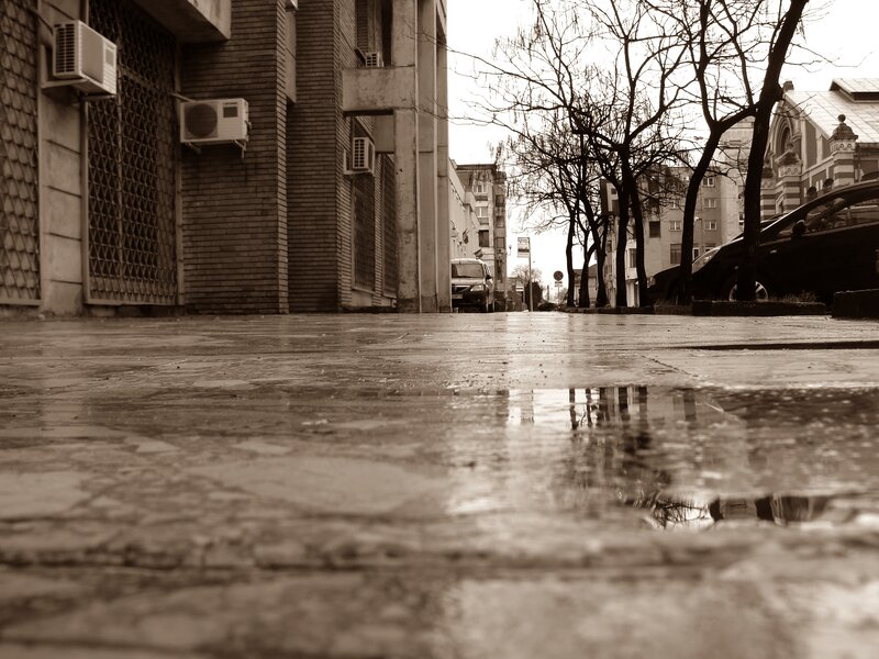 wet street with puddle reflection