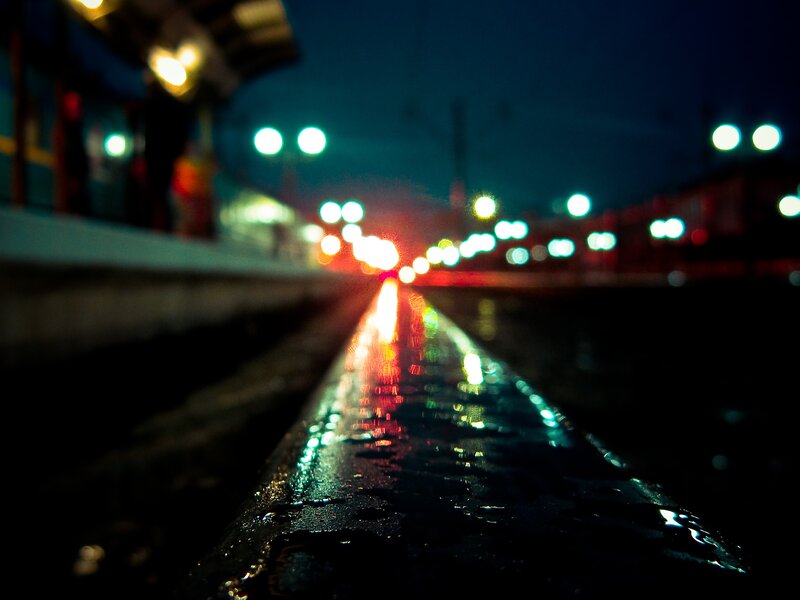 wet train tracks at night