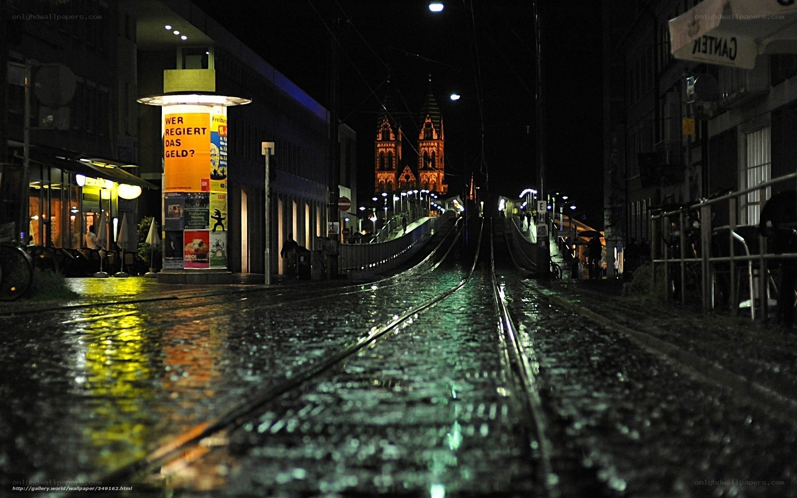 Wet tram tracks at night