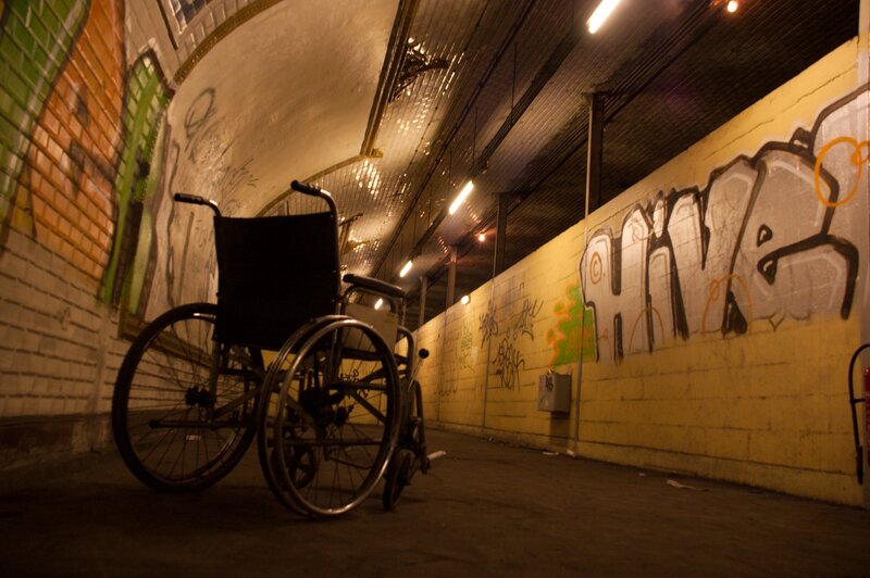 wheelchair in a graffiti tunnel