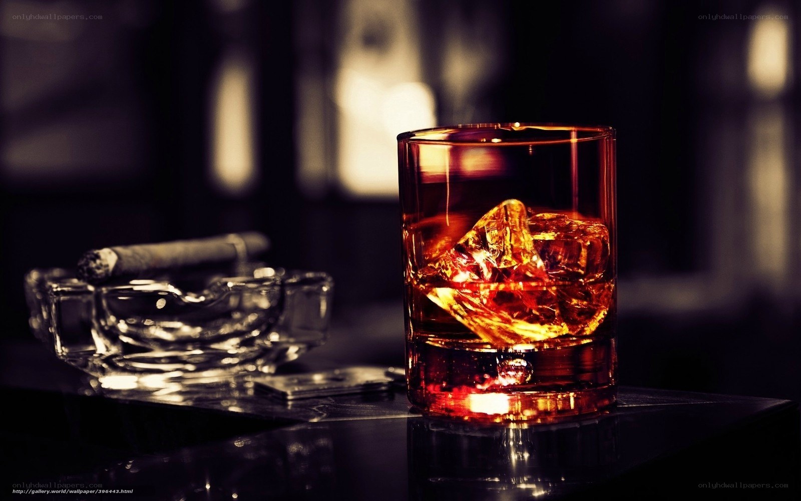 Whiskey and cigar on dark table