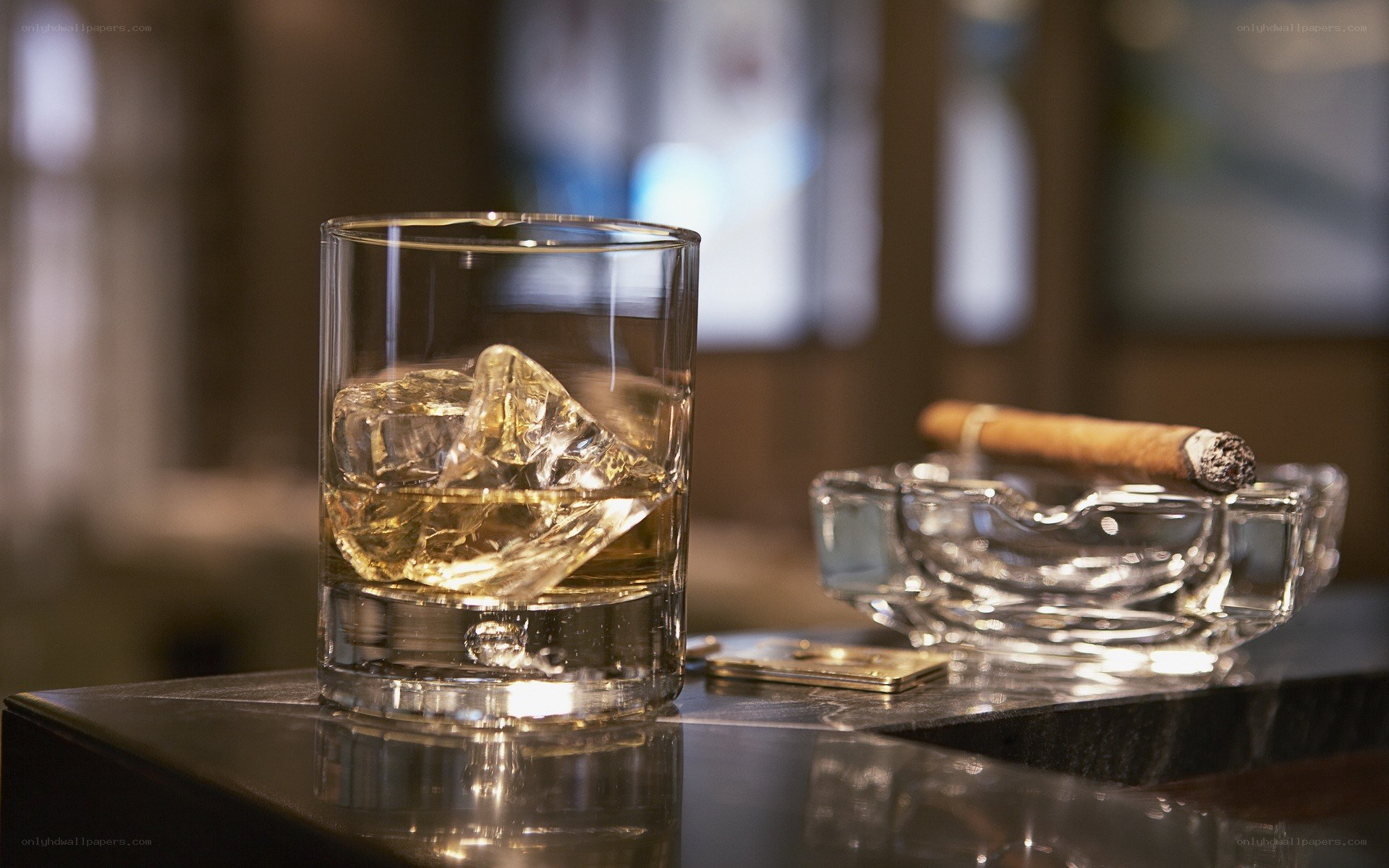 whiskey and cigar on table
