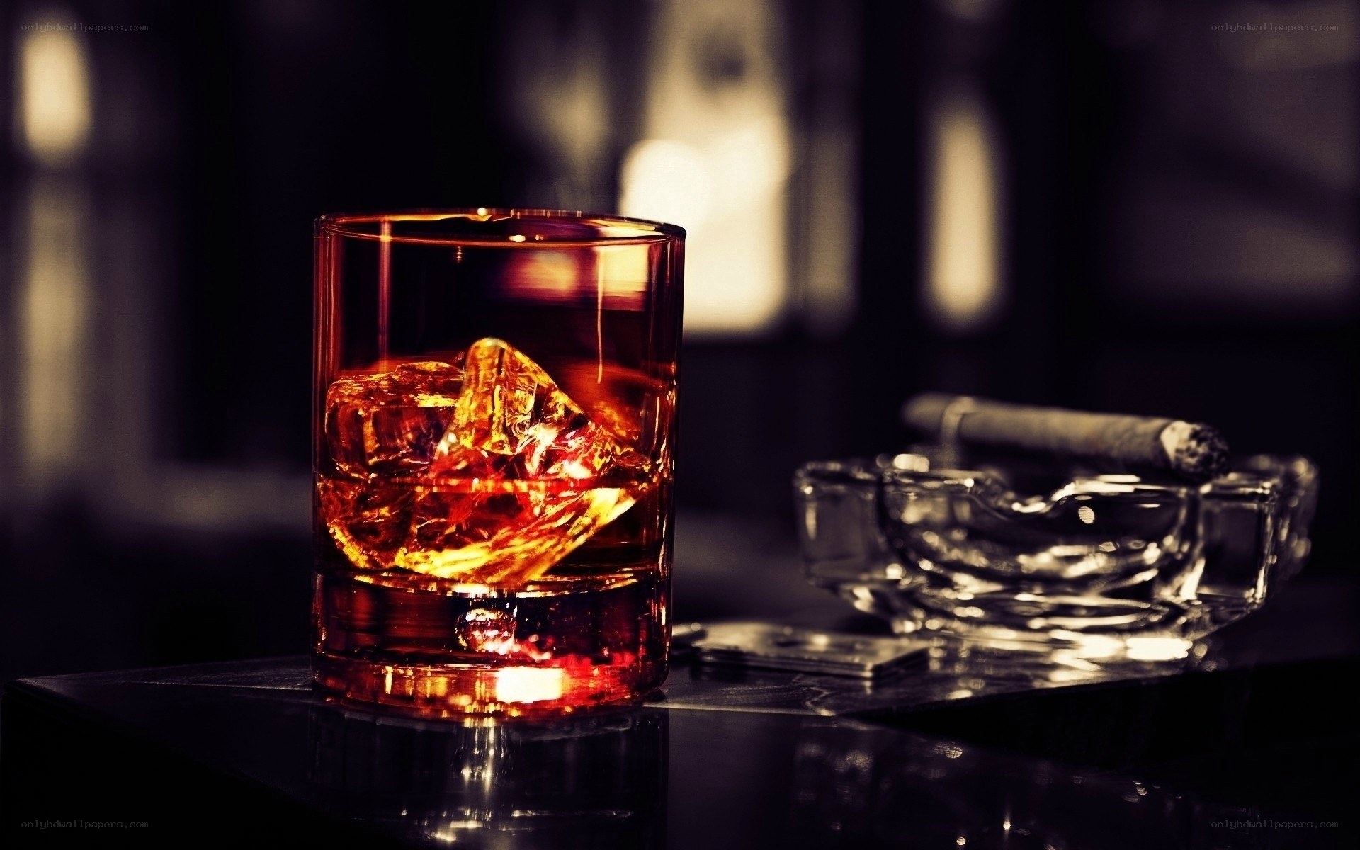whiskey and cigar on table