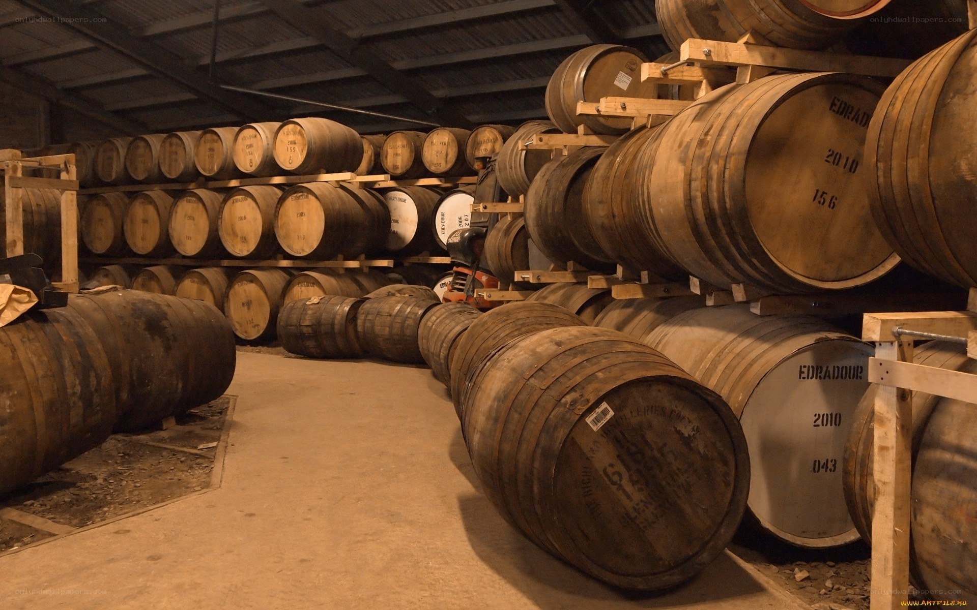 Whiskey barrels in a warehouse