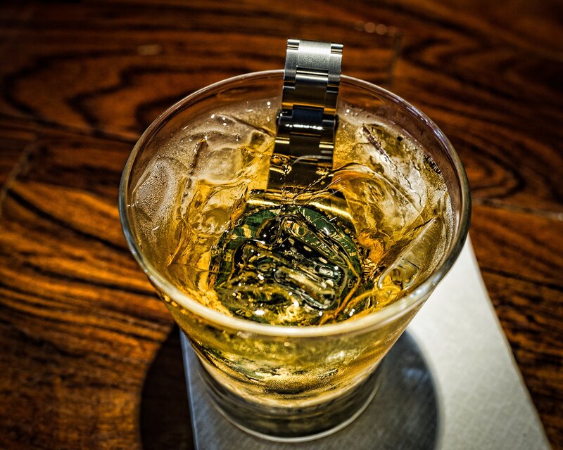 Whiskey drink with watch