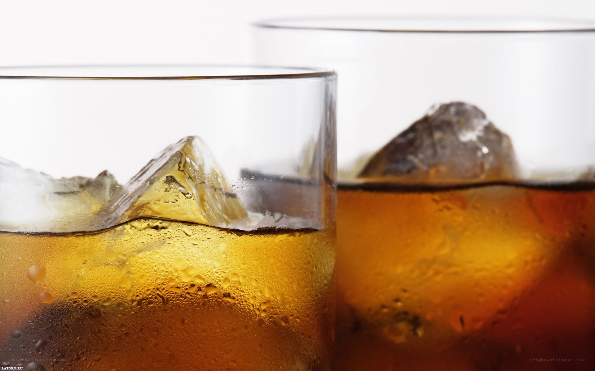 Whiskey with ice in glasses