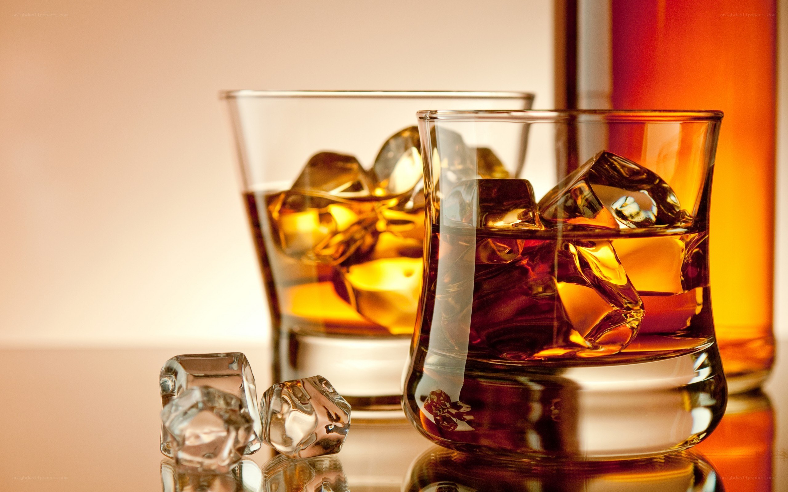 Whiskey with ice in glasses