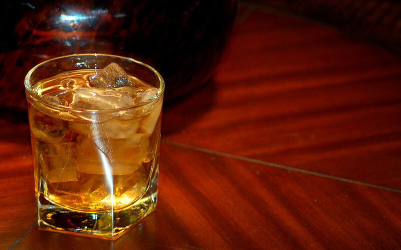 whiskey with ice on wood