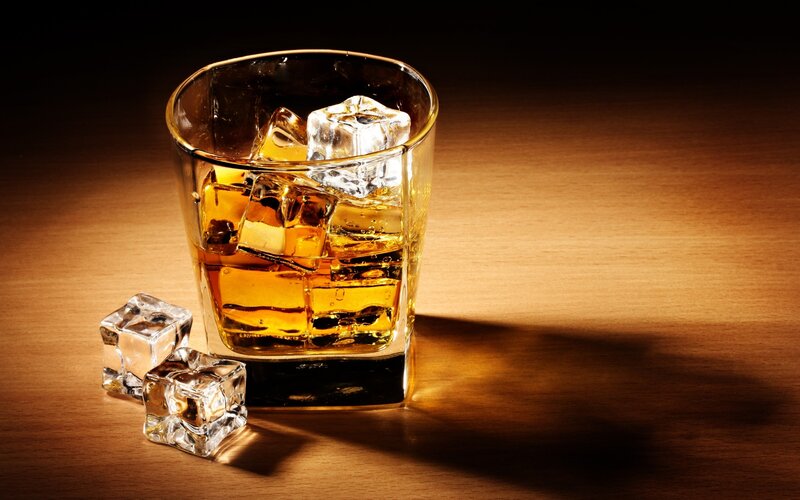 whiskey with ice on wood