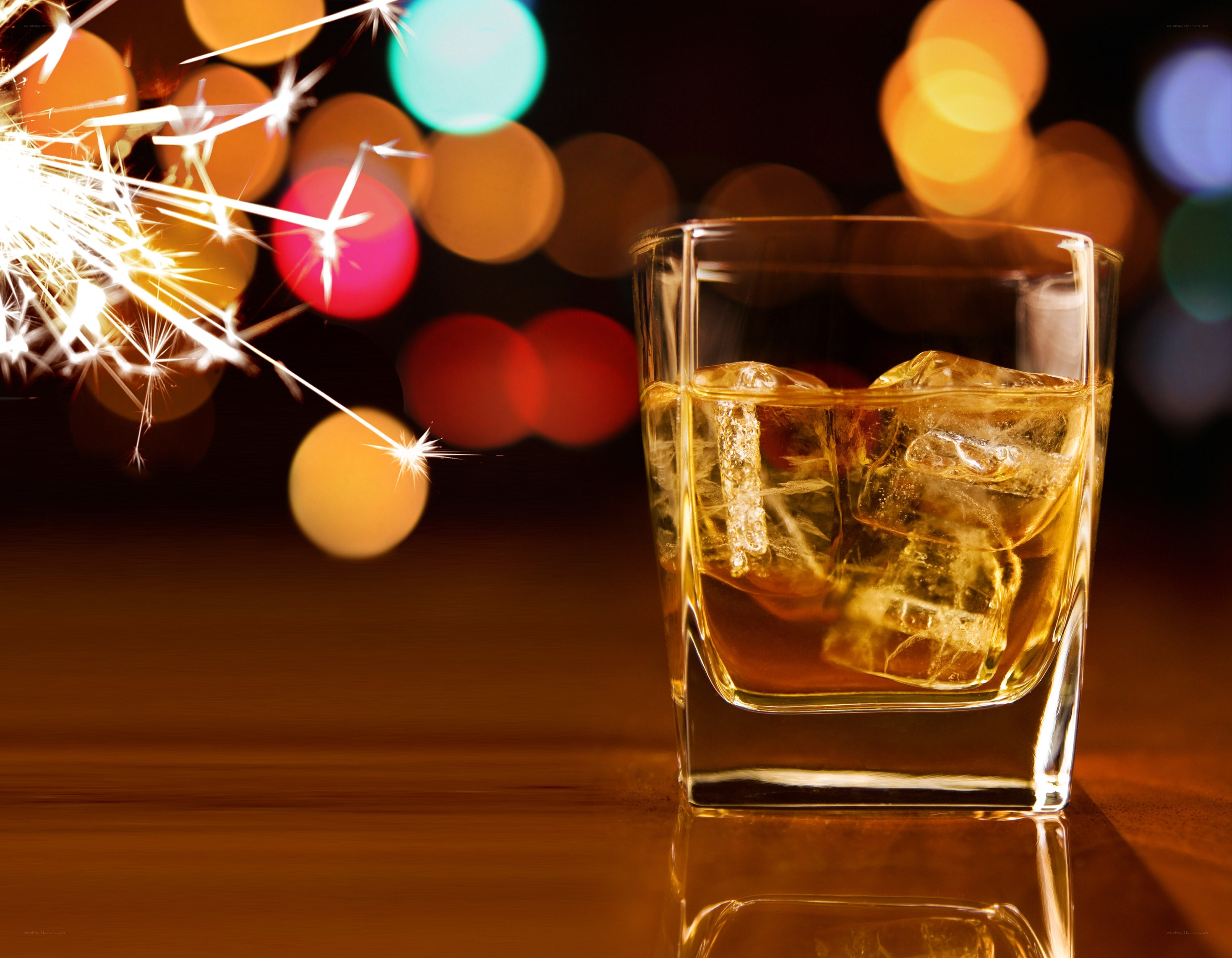 Whiskey with sparkler and lights