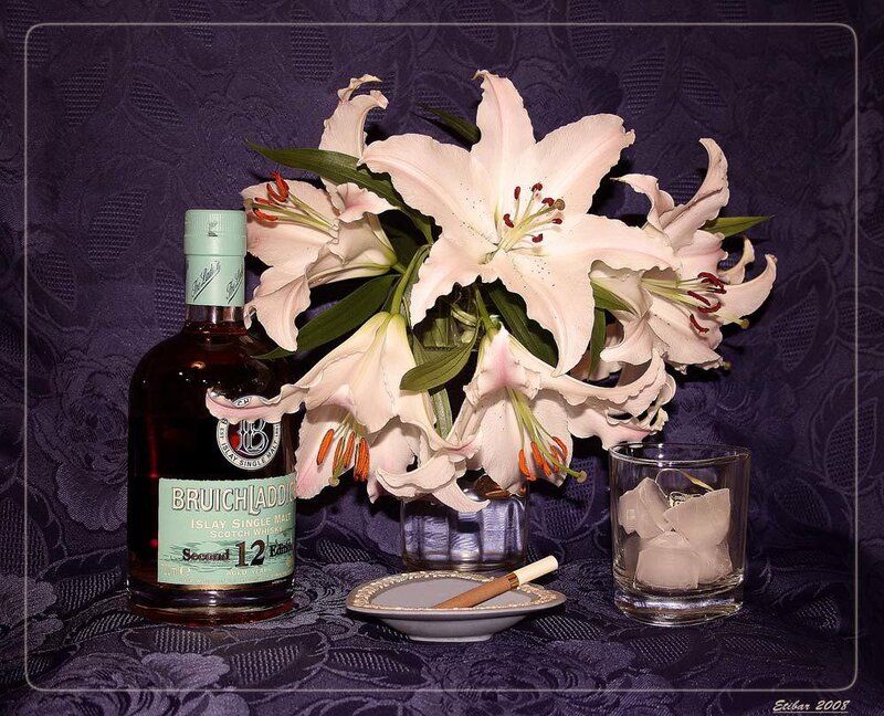 Whisky and lilies still life