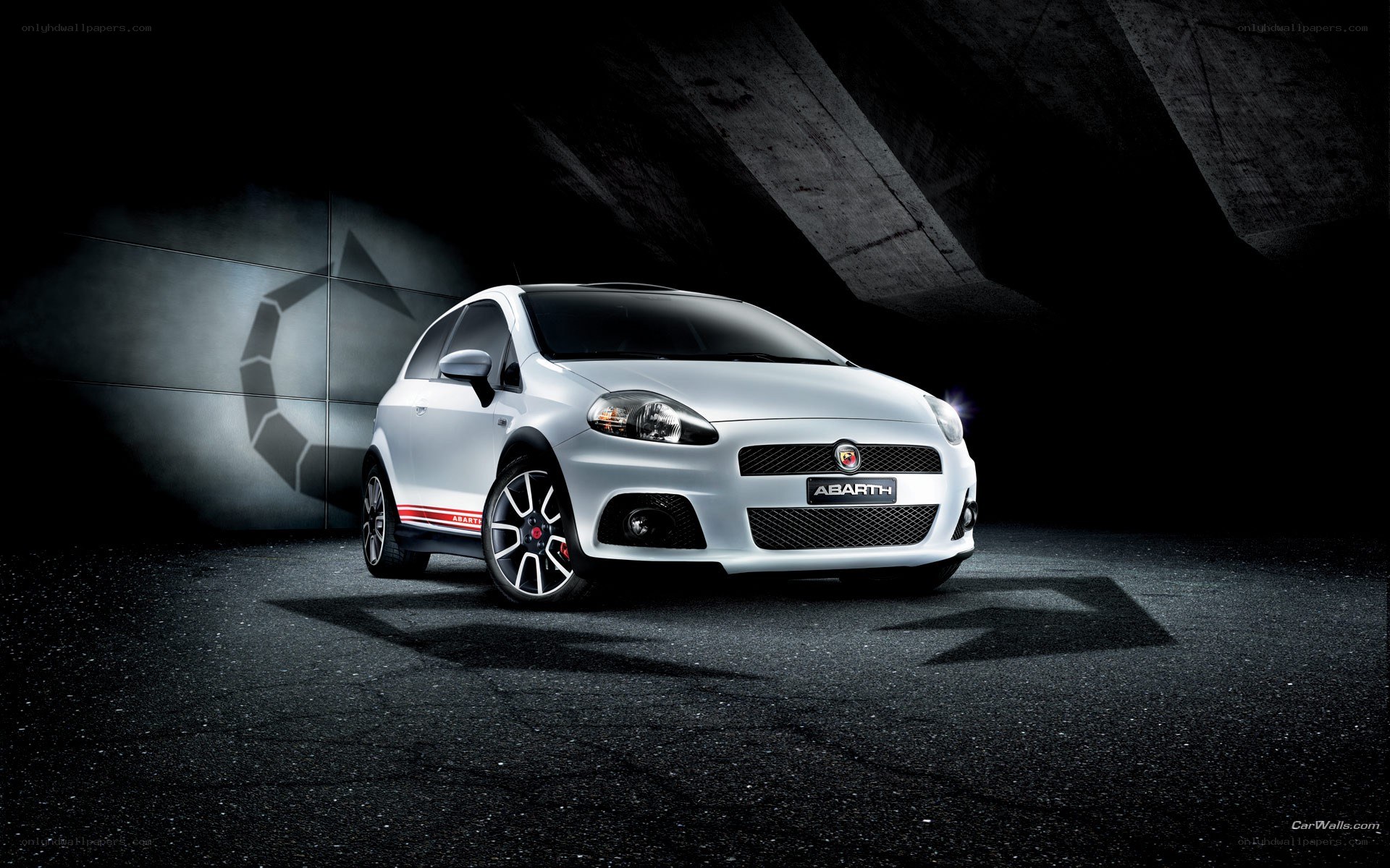 White Abarth car in dark setting