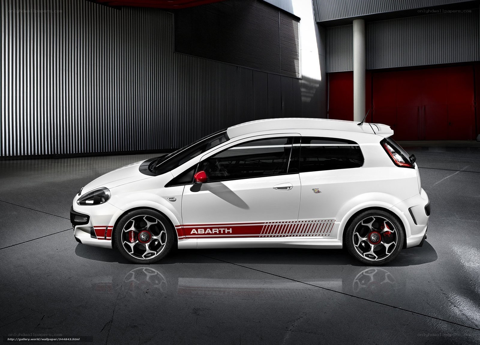 White Abarth car in garage