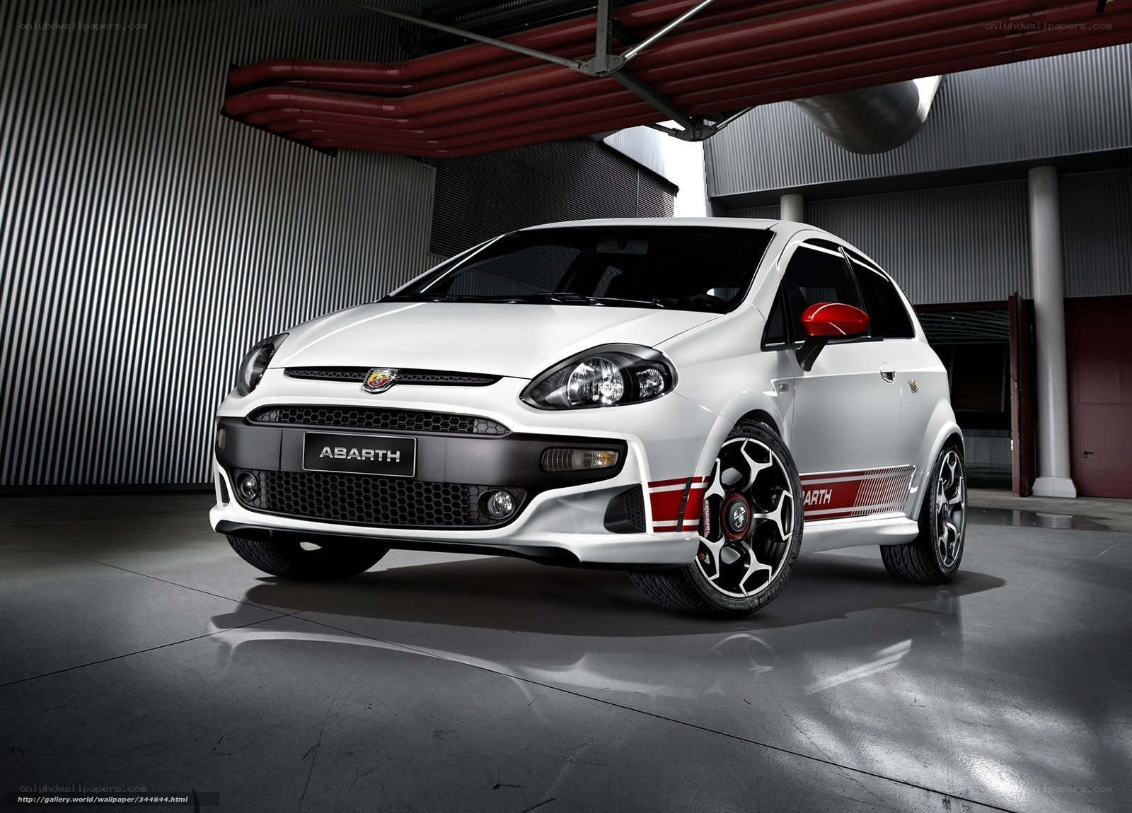 White Abarth car in garage