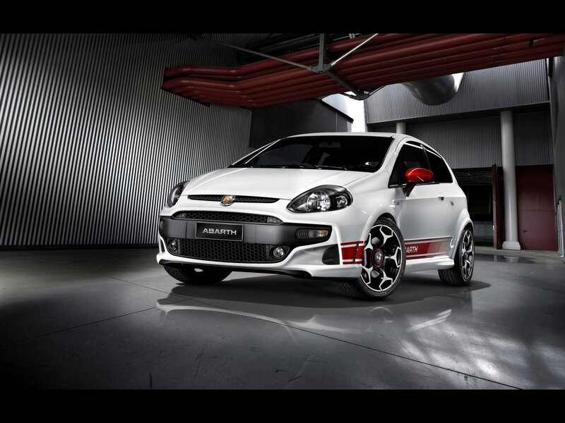 White Abarth car in garage