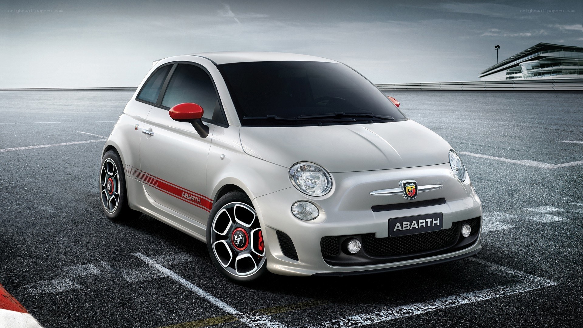 White Abarth car on racetrack