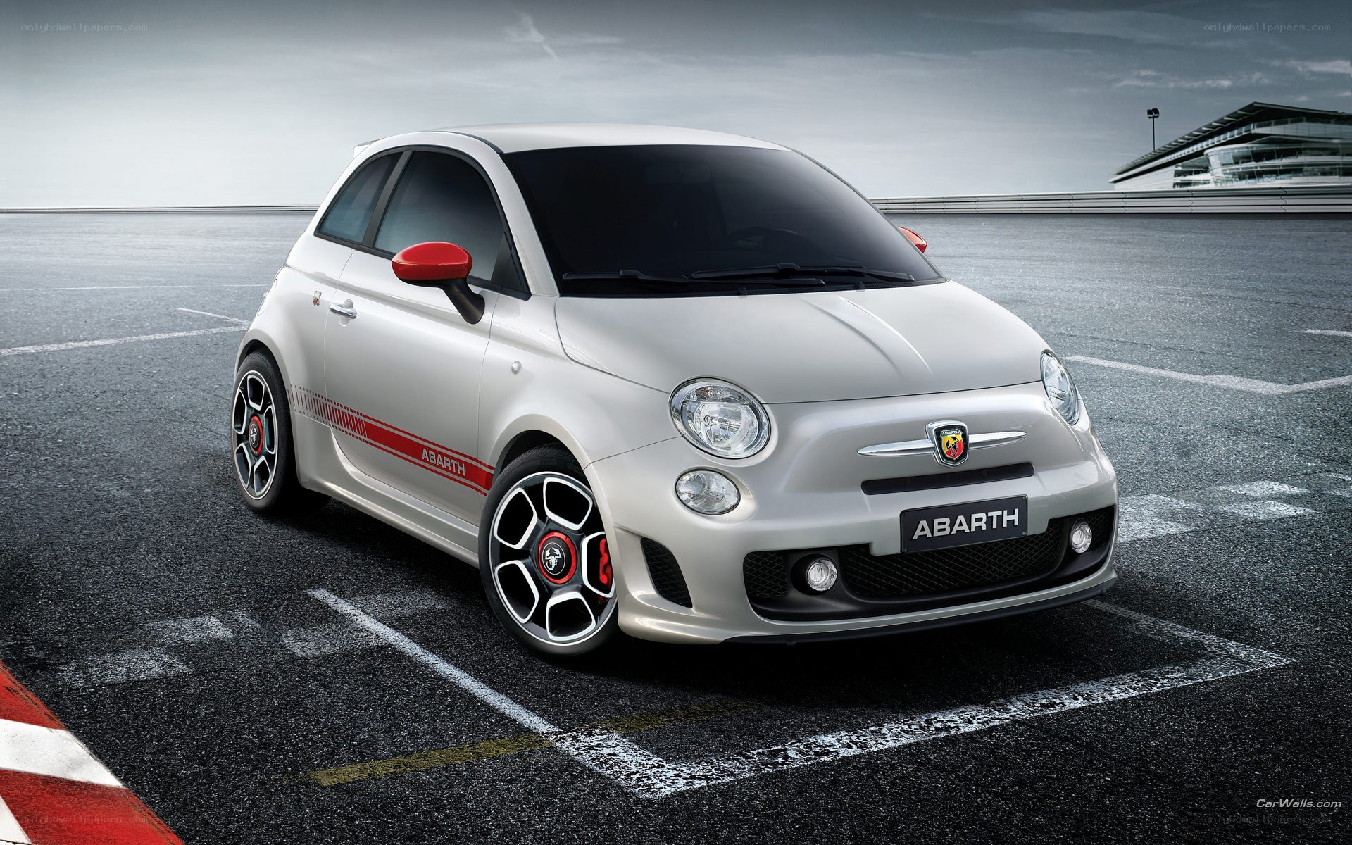 White Abarth car on racetrack