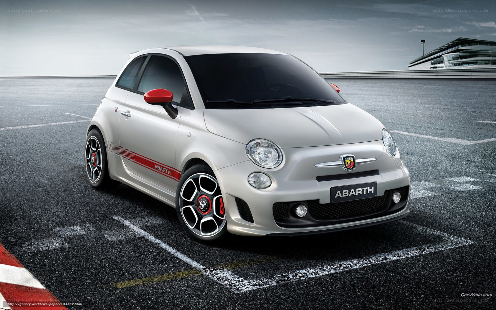 White Abarth car on racetrack