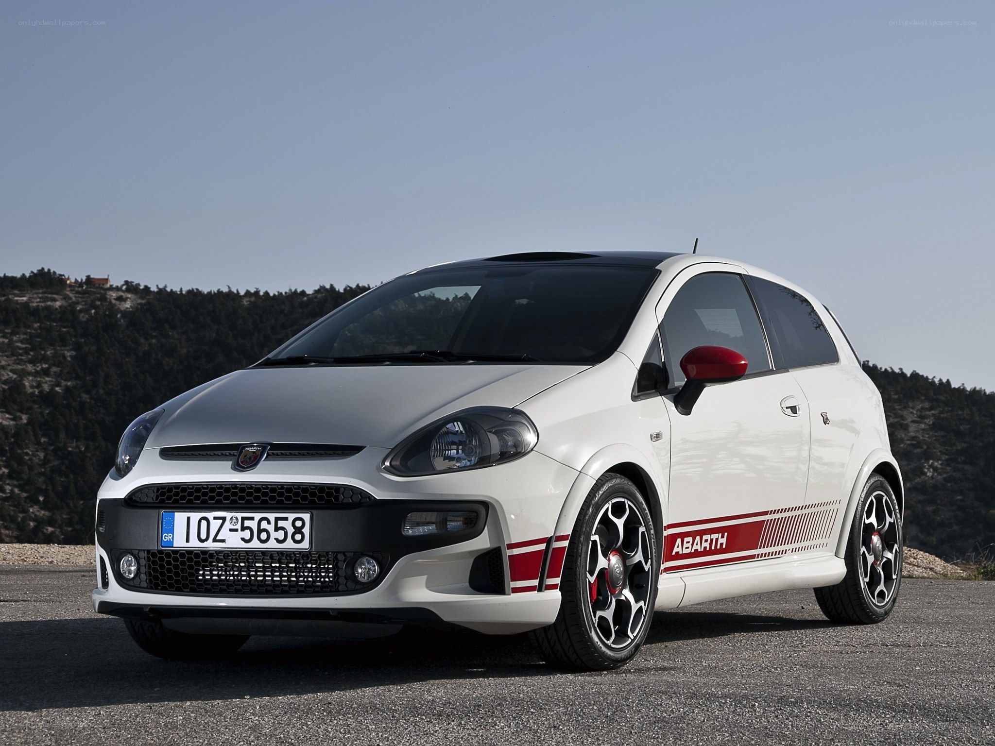 white abarth car on road