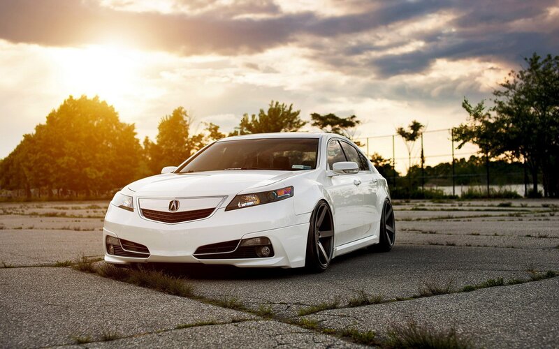 white acura in parking lot