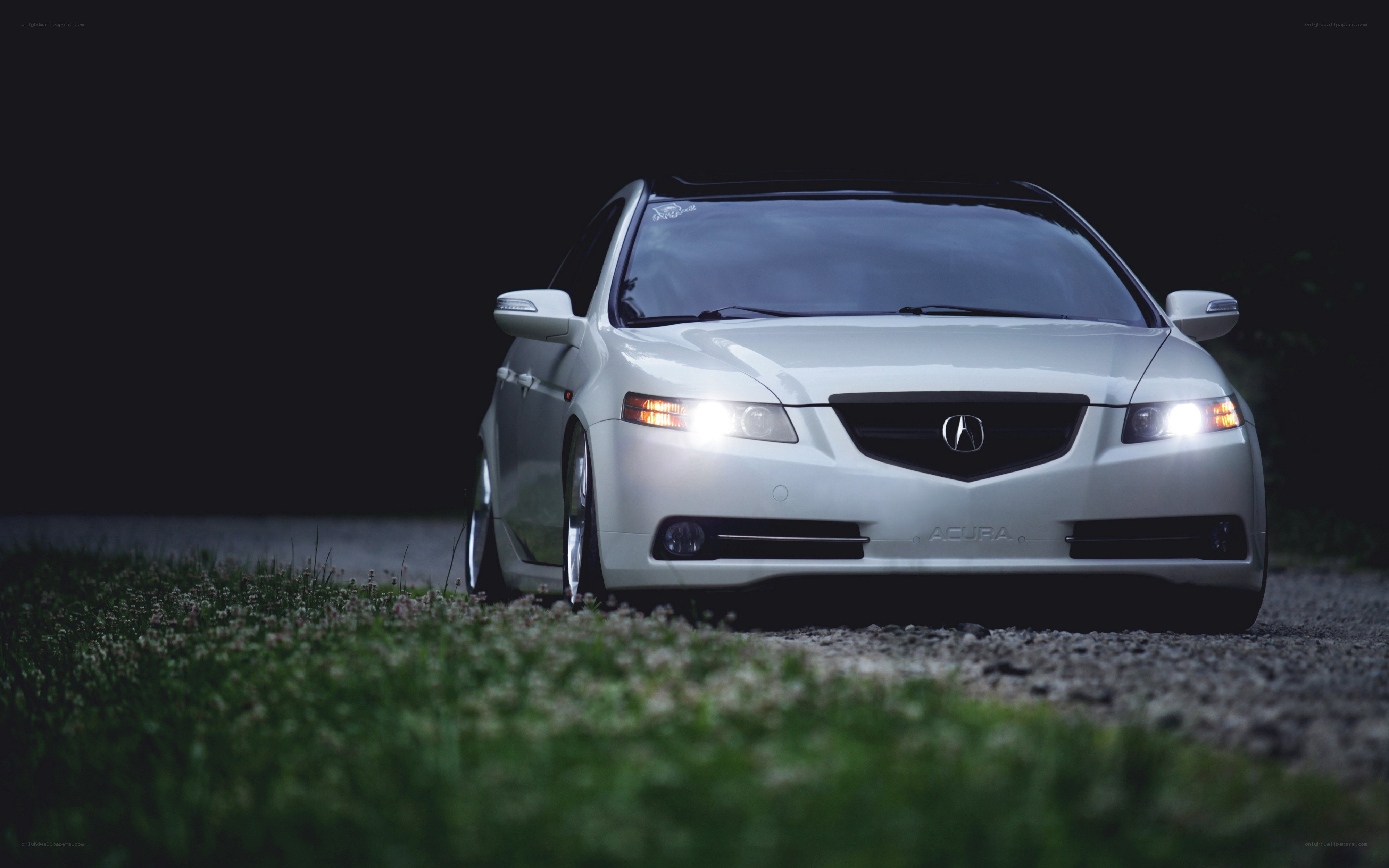 white acura in the dark