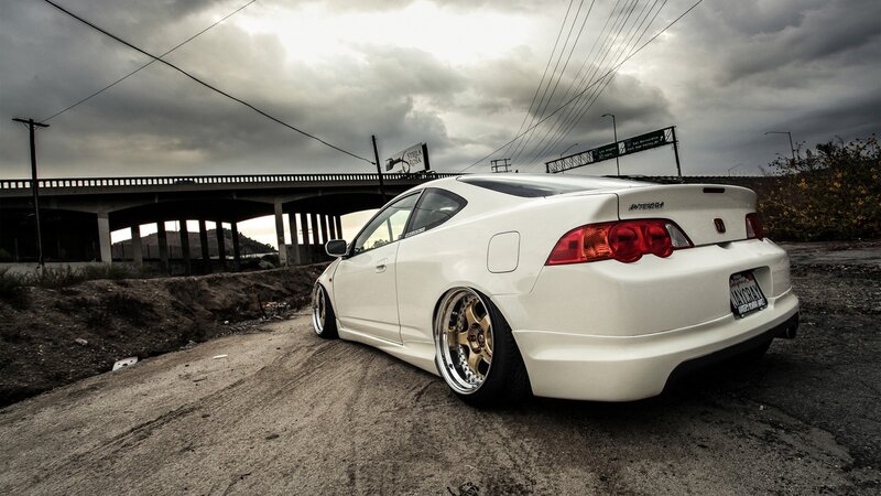 white acura integra on dirt road