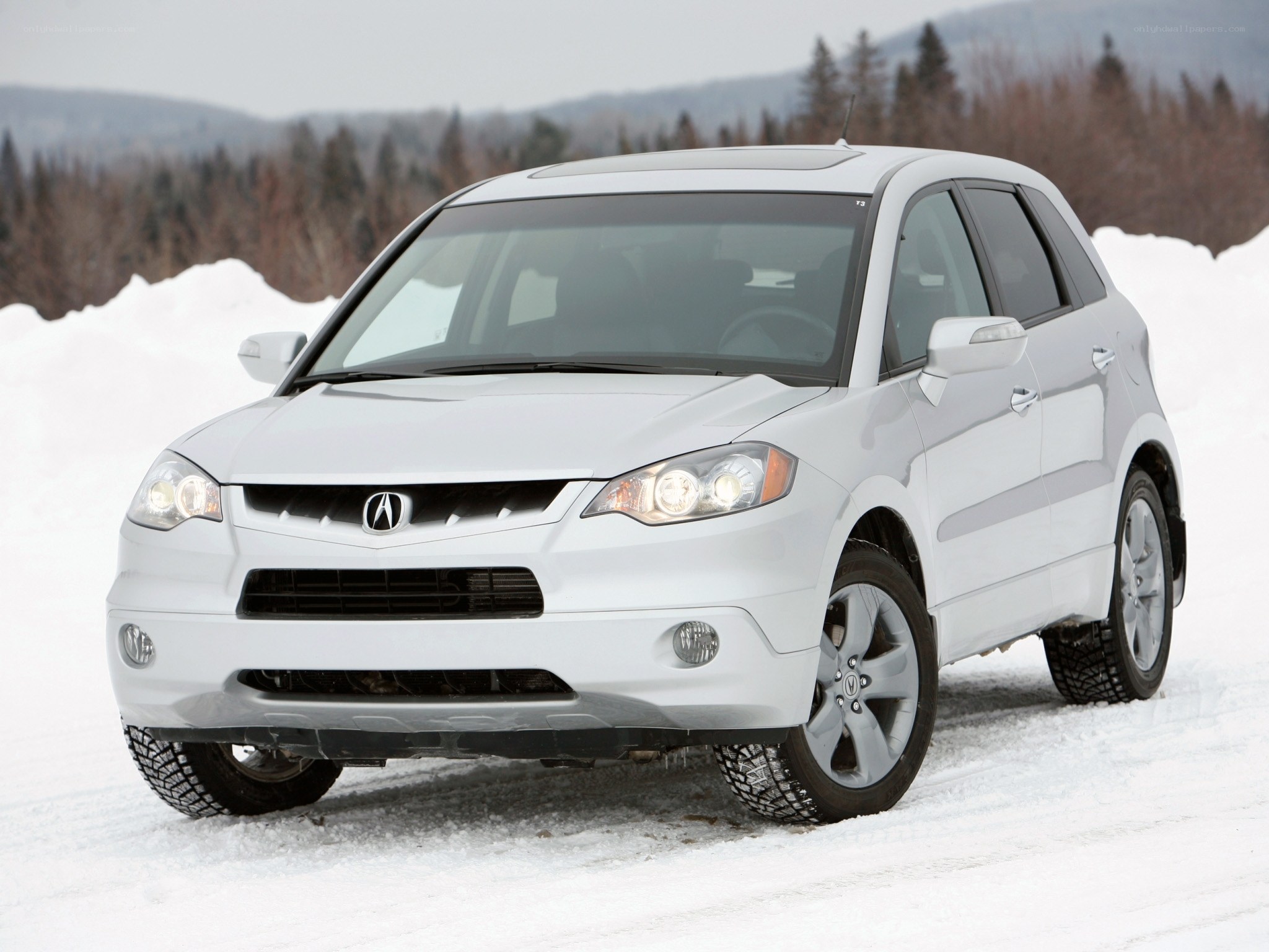 White Acura RDX in snow