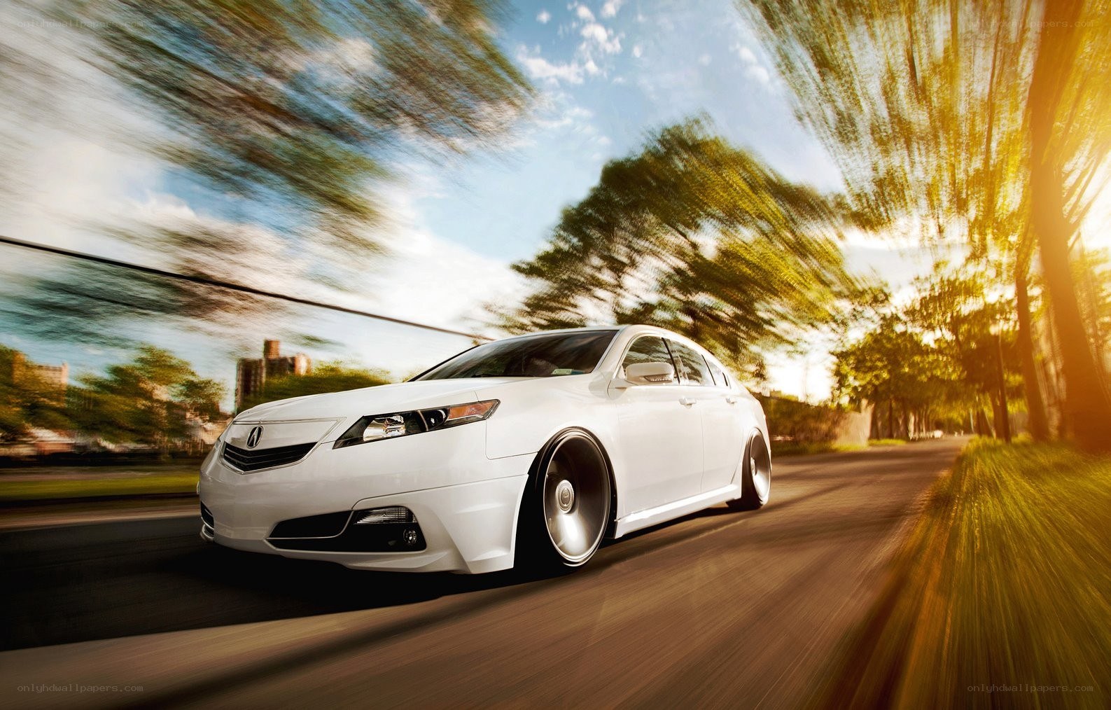 White Acura speeding on road