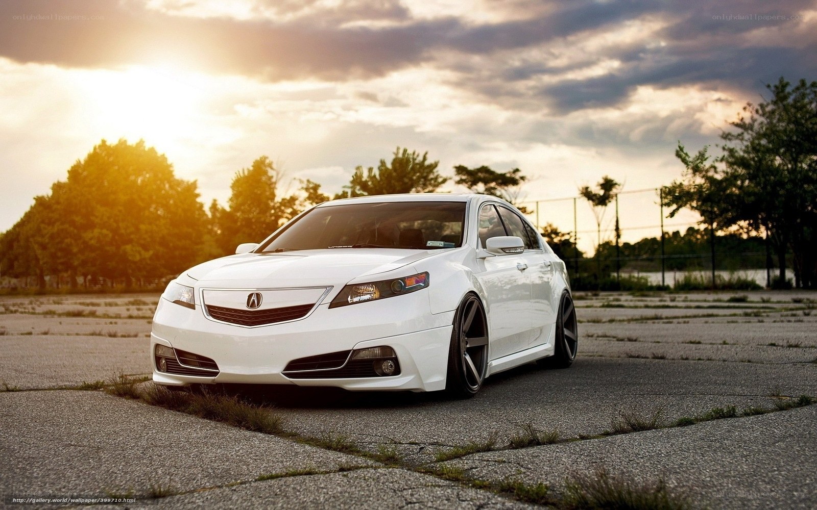 White Acura TL at sunset