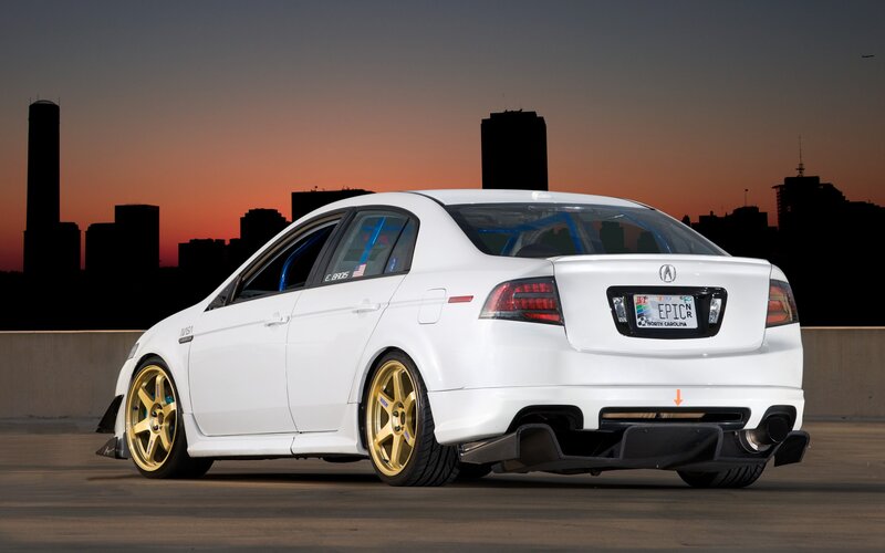 white acura with gold wheels
