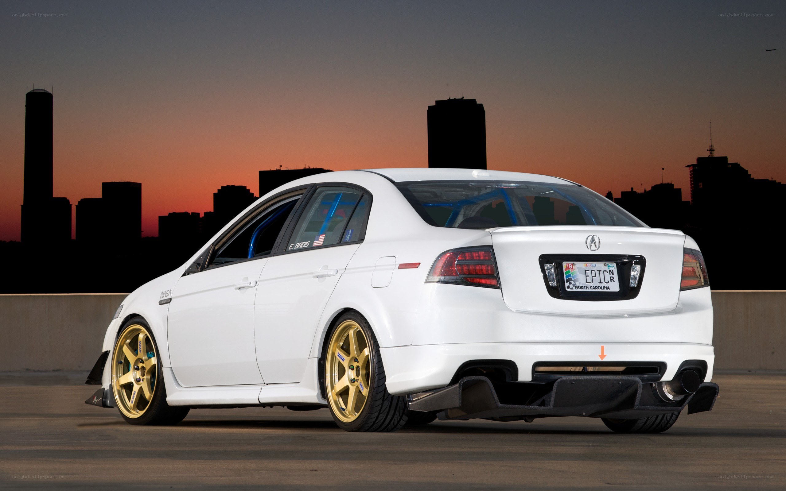 white acura with gold wheels
