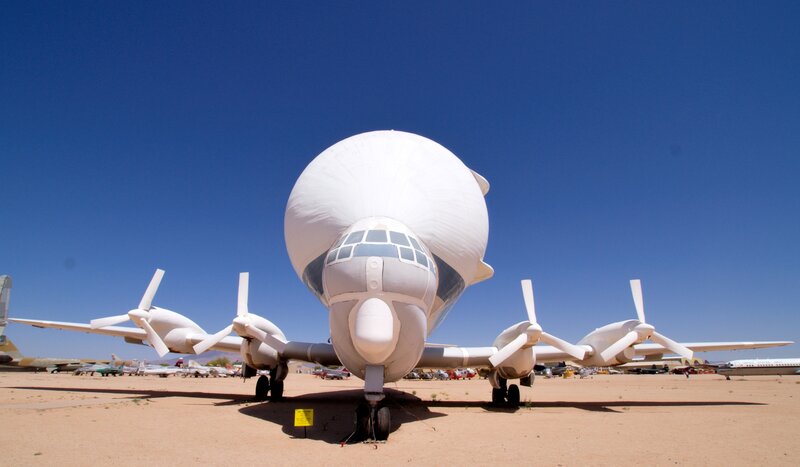 White aircraft with large radome