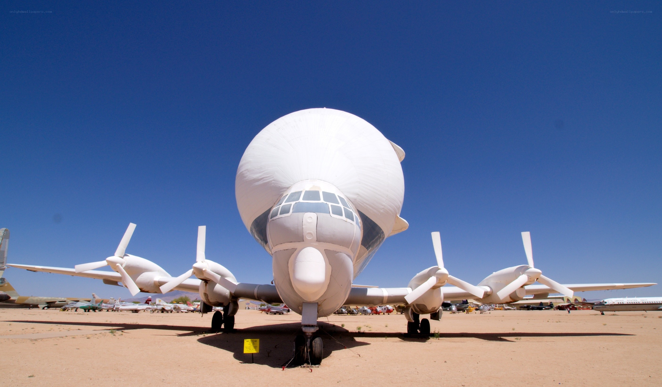 White aircraft with large radome