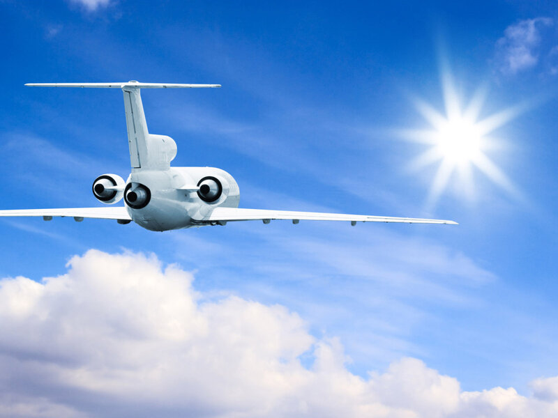 White Airplane in Flight — Blue