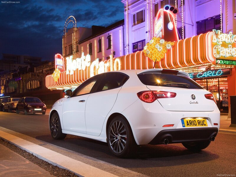 White Alfa Romeo Giulietta at night