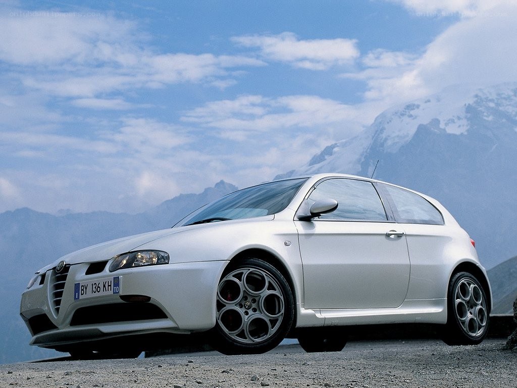 white alfa romeo in mountains
