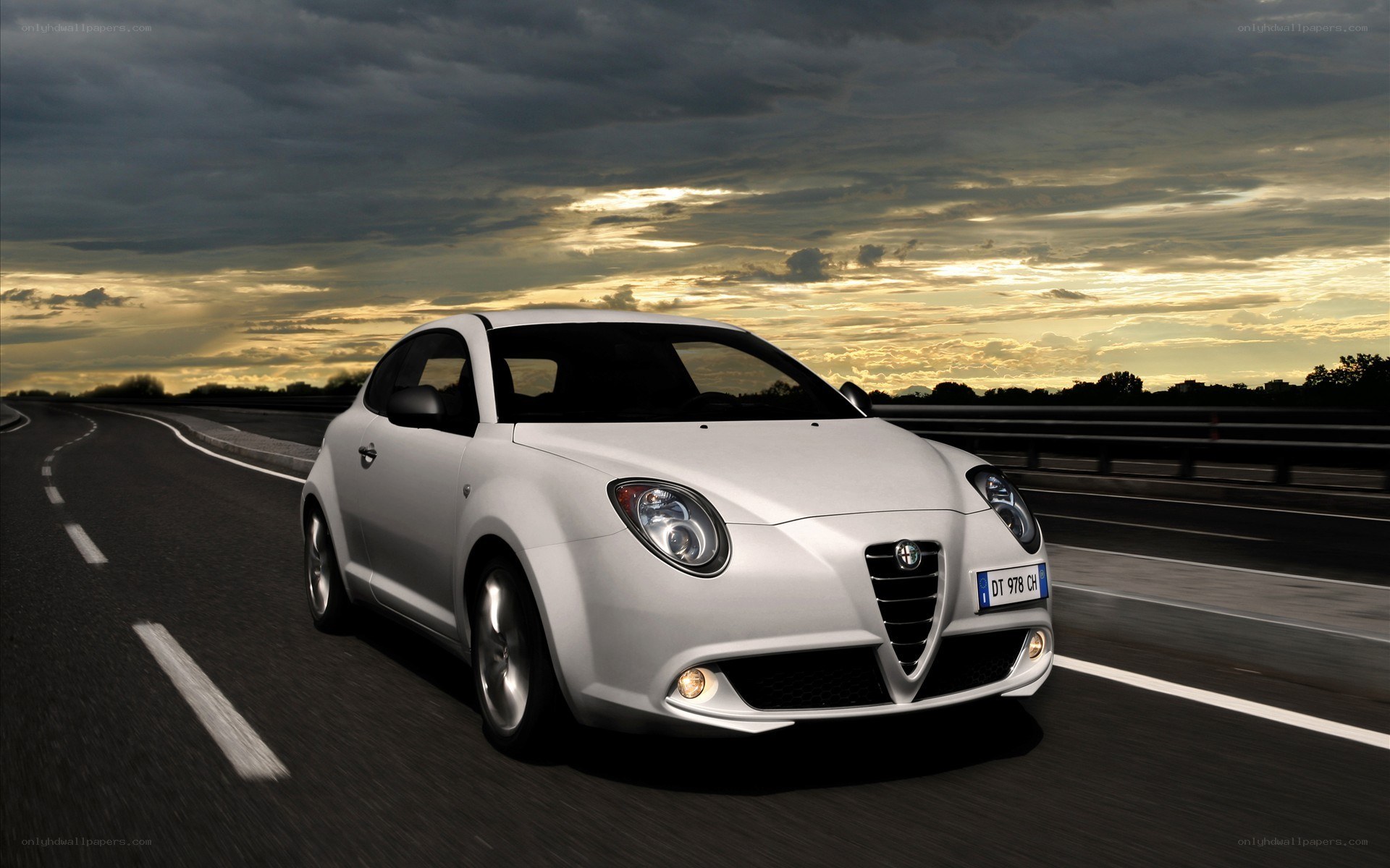 White Alfa Romeo on a highway