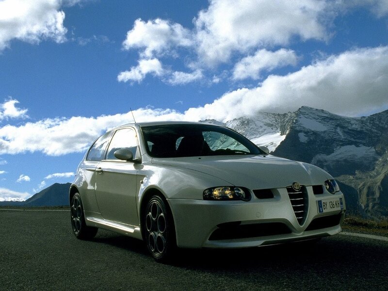 White Alfa Romeo on mountain road