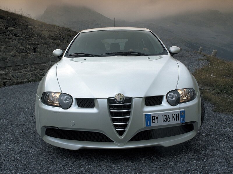 White Alfa Romeo on mountain road