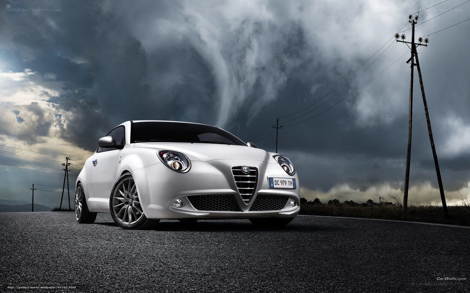 White Alfa Romeo on stormy road