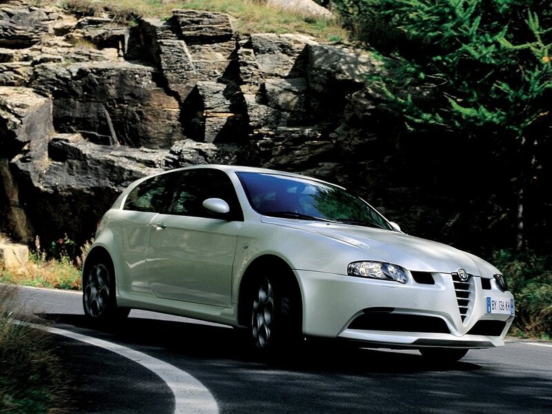 white alfa romeo on winding road