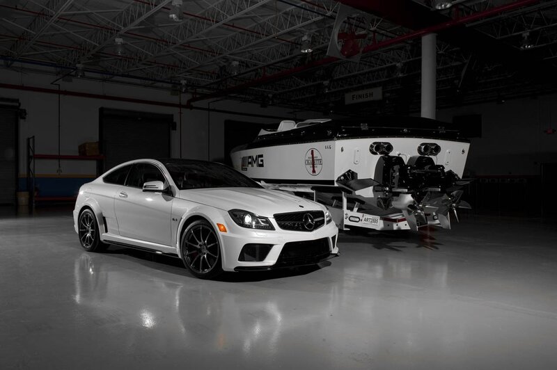 White AMG car and boat in garage