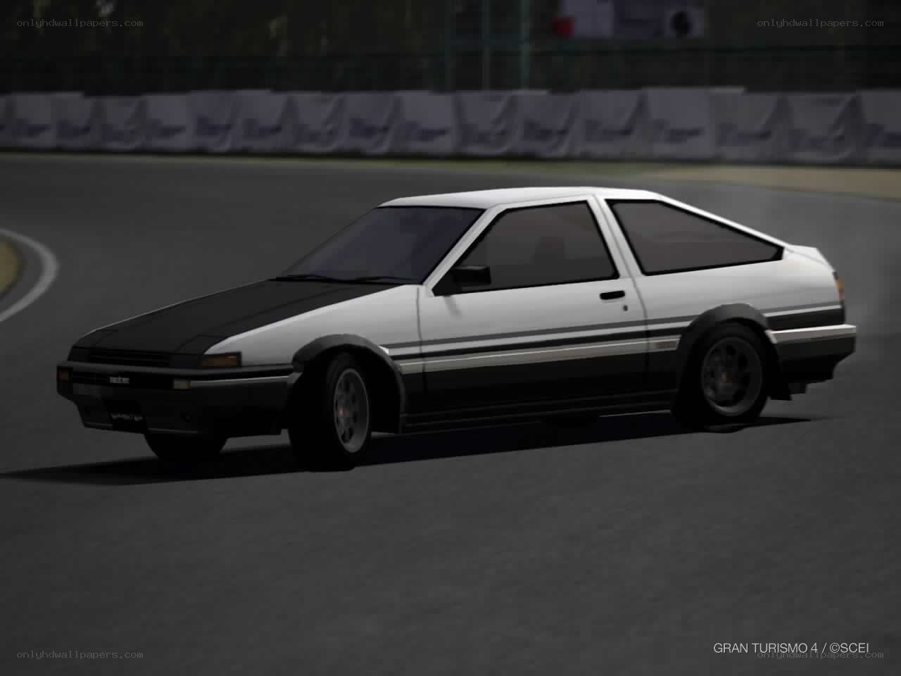 white and black AE86 on a racetrack