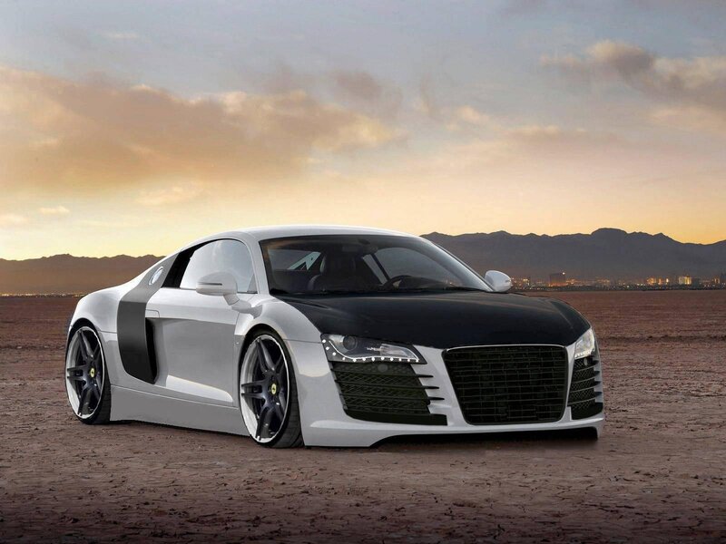White and black Audi R8 in desert