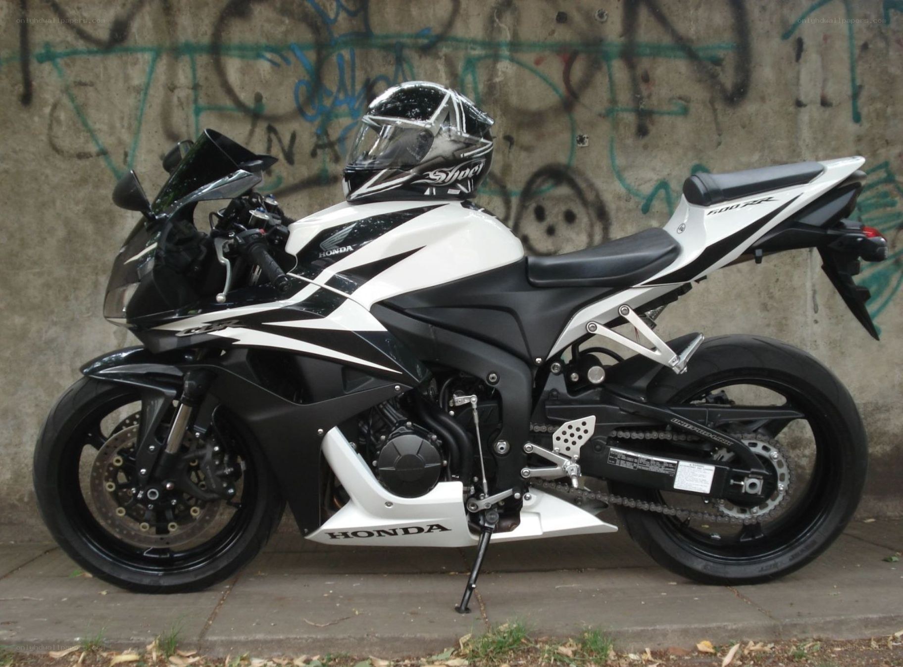 white and black Honda motorcycle