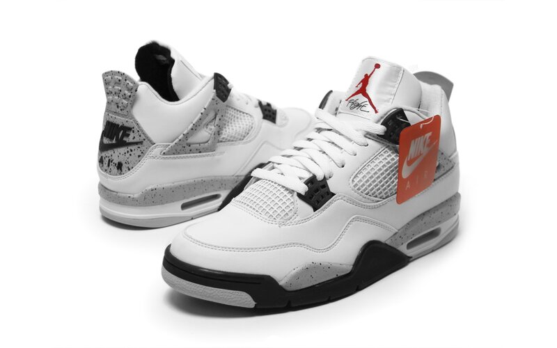 White and black Jordan 4 sneakers