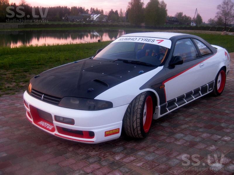 White and Black Race Car — Serene