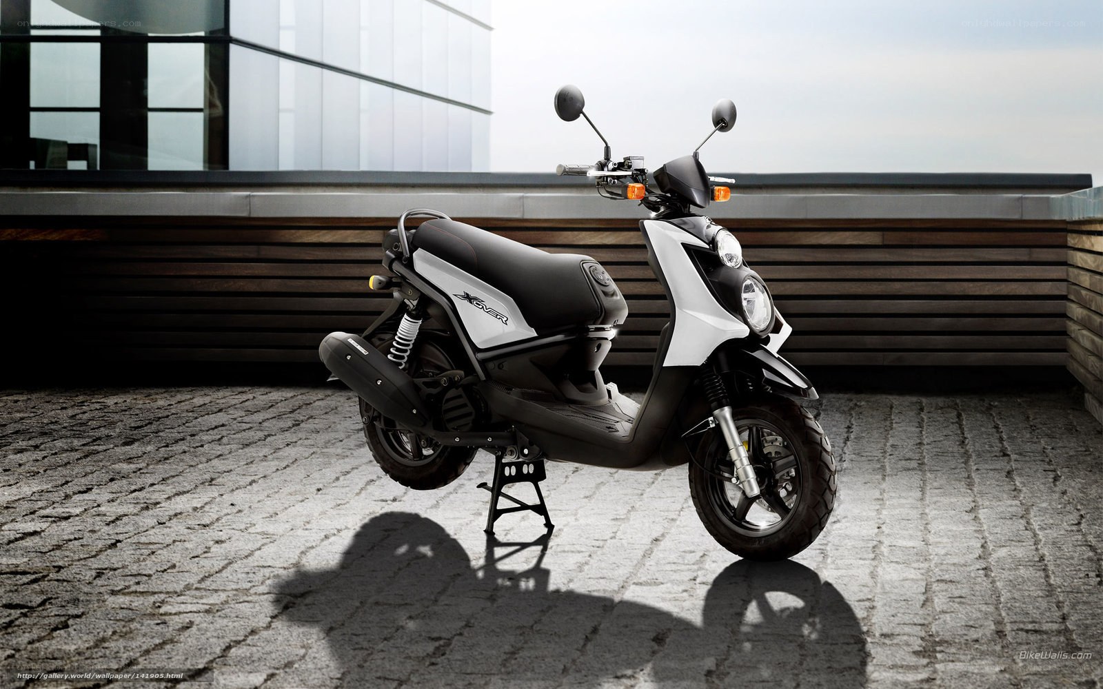 White and black scooter on pavement