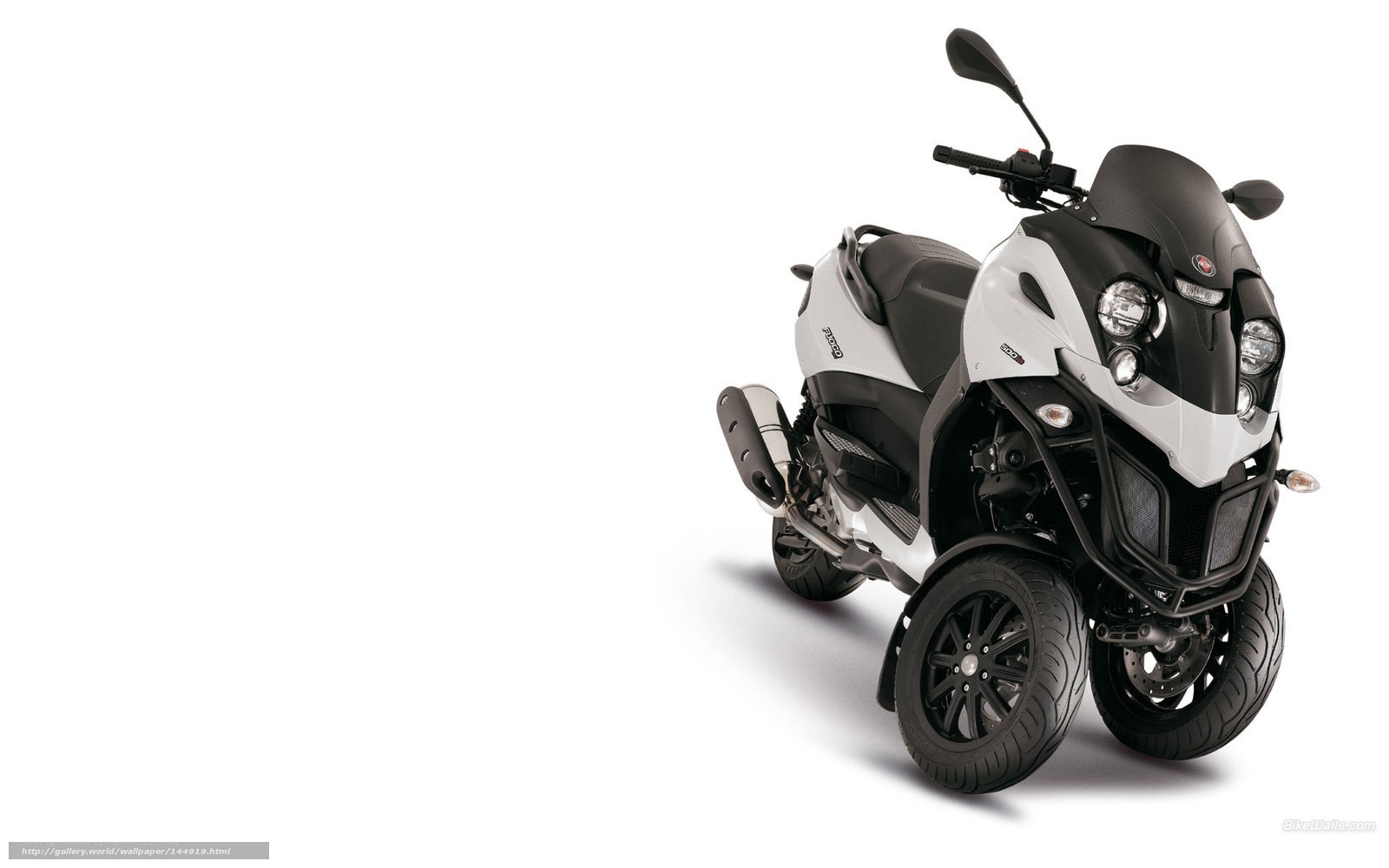 white and black three-wheeled scooter