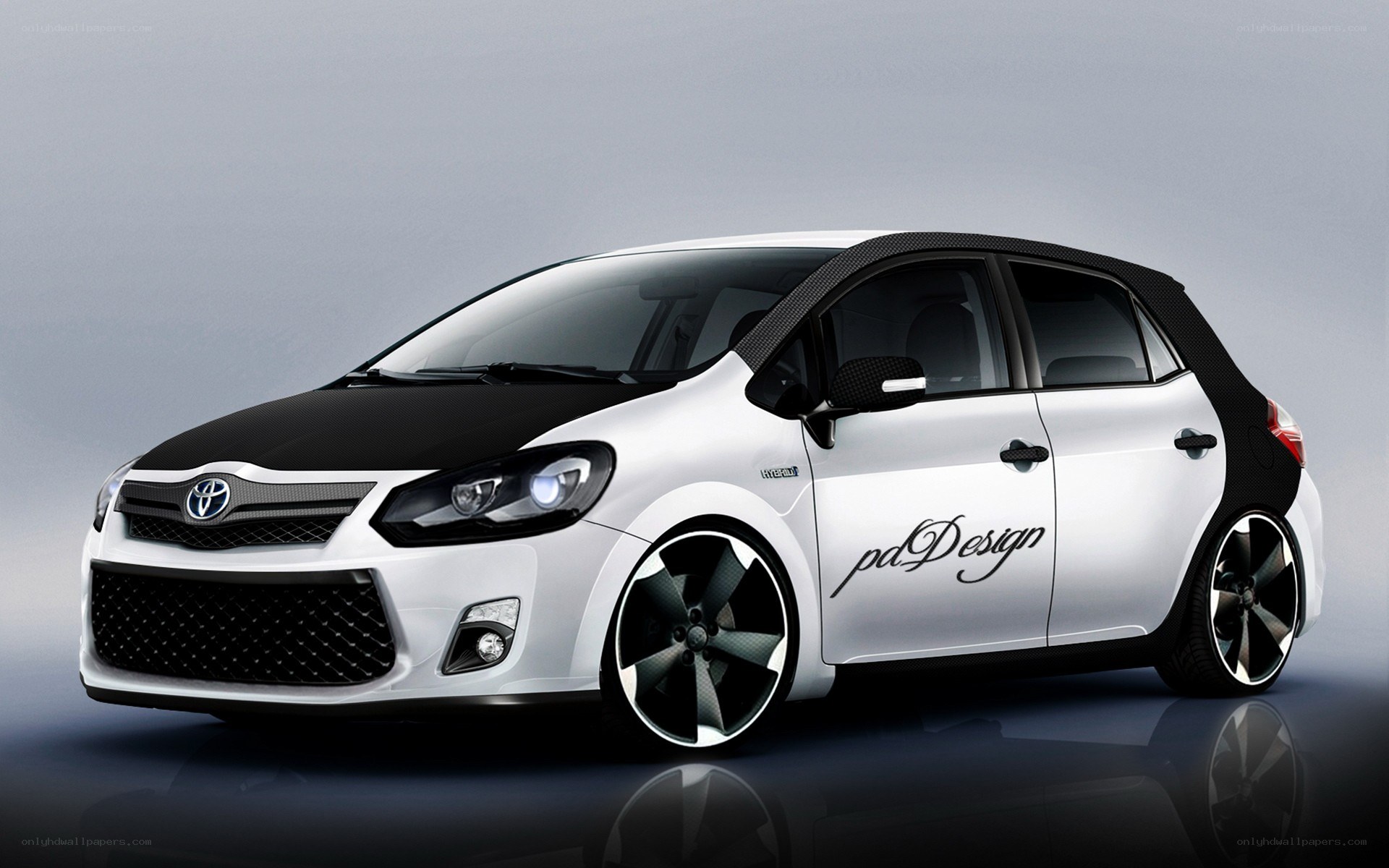 white and black toyota hatchback